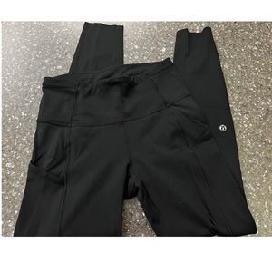 Lululemon size 4 black leggings with dots detail at bottom of leg